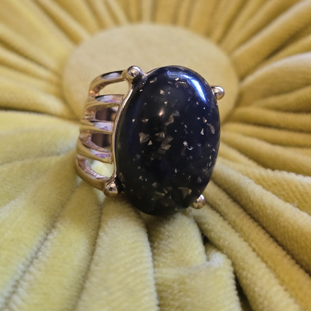 Gold ring with black stone